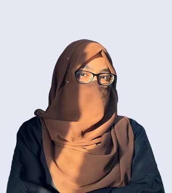 Ayesha Binte Habib, Head of Marketing at Report AI 365, wearing glasses and a brown headscarf against a pale grey background